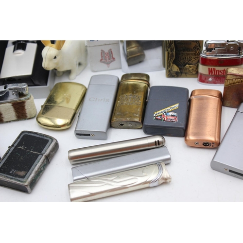 1241 - Twenty five assorted cigarette lighters to include Zippo style, novelty etc.