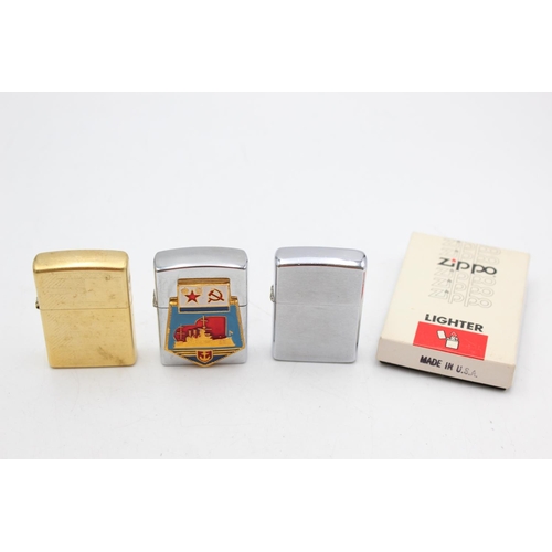 1245 - Three assorted Zippo cigarette lighters