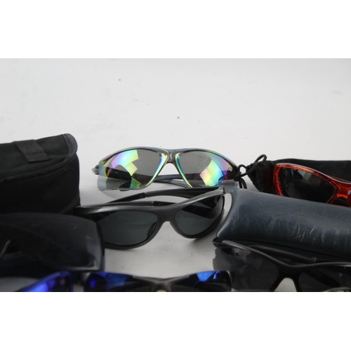108 - A collection of assorted pairs of unisex sports style sunglasses to include Choppers, Revision, Uvex... 