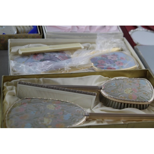 113 - Nine boxed vintage women's vanity dressing table mirrors and brushes sets