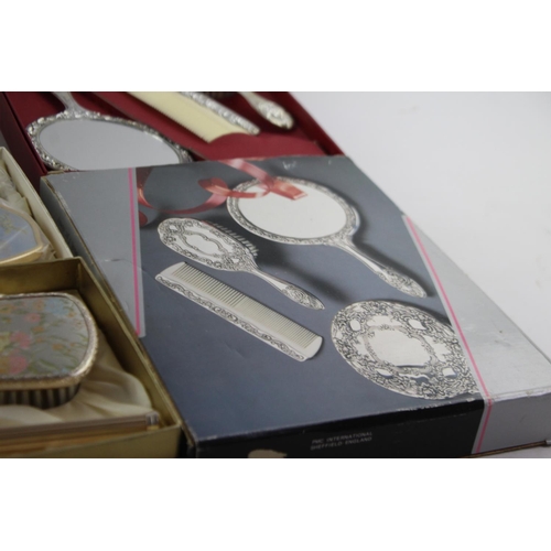 113 - Nine boxed vintage women's vanity dressing table mirrors and brushes sets