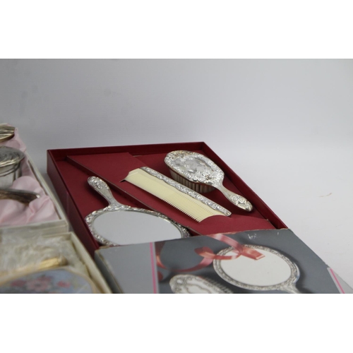 113 - Nine boxed vintage women's vanity dressing table mirrors and brushes sets