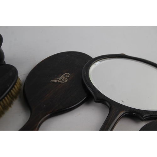 207 - Nine antique ebony women's vanity items to include some with hallmarked .925 sterling silver overlay