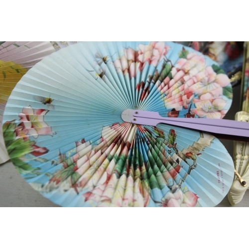 211 - A collection of assorted vintage women's hand fans