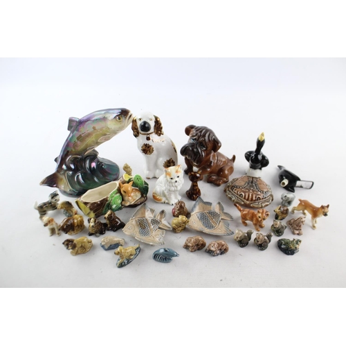 45 - A collection of assorted ceramic figurines to include Hornsea, Wade Whimsies, Jema Holland etc.