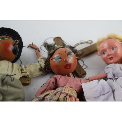79 - Four assorted vintage Pelham puppets to include Cinderella etc.