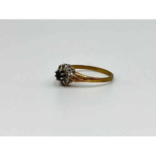 1038 - A 9ct gold sapphire and diamond halo ring, size N½ - approx. gross weight 1.5 grams