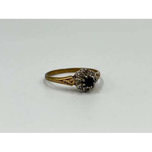 1038 - A 9ct gold sapphire and diamond halo ring, size N½ - approx. gross weight 1.5 grams