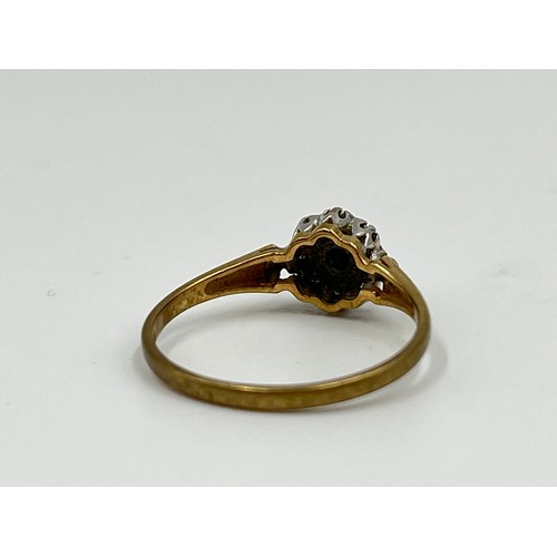 1038 - A 9ct gold sapphire and diamond halo ring, size N½ - approx. gross weight 1.5 grams