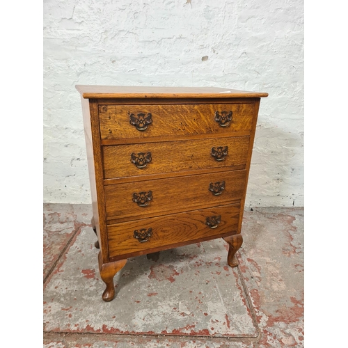 262 - A mid 20th century miniature oak chest of four drawers with cabriole supports - approx. 68cm high x ... 