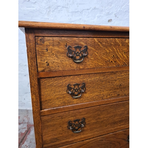 262 - A mid 20th century miniature oak chest of four drawers with cabriole supports - approx. 68cm high x ... 