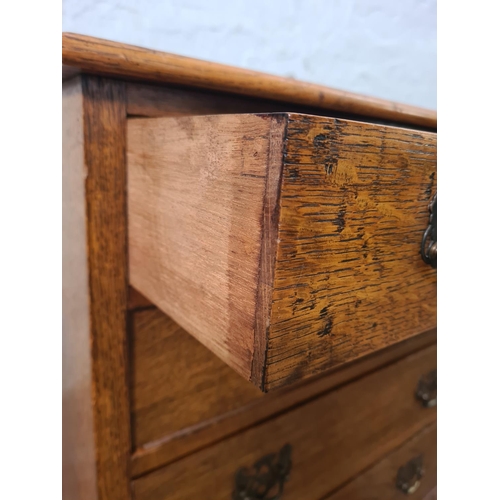 262 - A mid 20th century miniature oak chest of four drawers with cabriole supports - approx. 68cm high x ... 