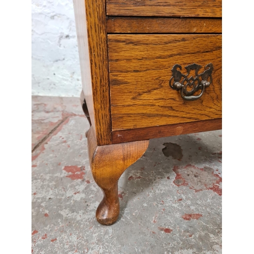 262 - A mid 20th century miniature oak chest of four drawers with cabriole supports - approx. 68cm high x ... 