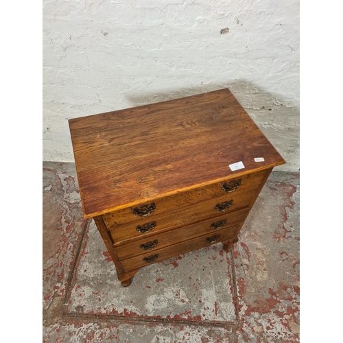 262 - A mid 20th century miniature oak chest of four drawers with cabriole supports - approx. 68cm high x ... 