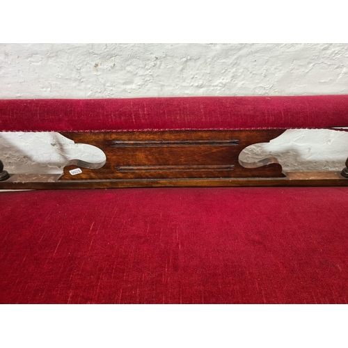 266 - A late Victorian oak and red upholstered chaise longue - approx. 70cm high x 58cm wide x 165cm long