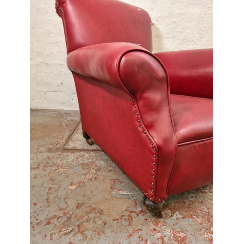 268 - An early 20th century red leatherette armchair - approx. 89cm high x 86cm wide x 88cm deep