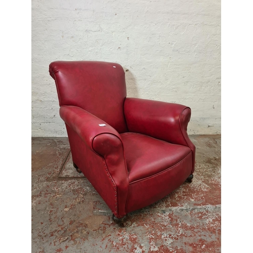 268 - An early 20th century red leatherette armchair - approx. 89cm high x 86cm wide x 88cm deep