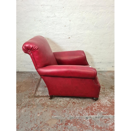 268 - An early 20th century red leatherette armchair - approx. 89cm high x 86cm wide x 88cm deep