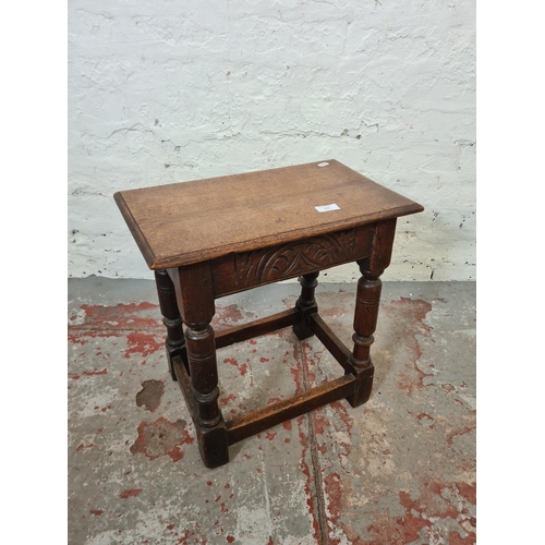 270 - A 17th century style solid oak rectangular joint side table with carved detailing - approx. 46cm hig... 