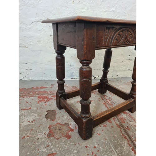 270 - A 17th century style solid oak rectangular joint side table with carved detailing - approx. 46cm hig... 