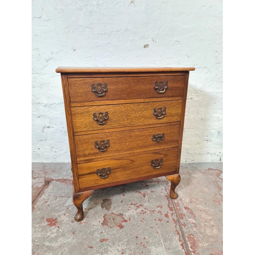 271 - A mid 20th century miniature oak chest of four drawers with cabriole supports - approx. 67cm high x ... 