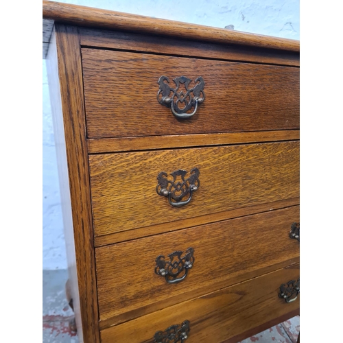 271 - A mid 20th century miniature oak chest of four drawers with cabriole supports - approx. 67cm high x ... 