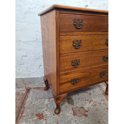 271 - A mid 20th century miniature oak chest of four drawers with cabriole supports - approx. 67cm high x ... 