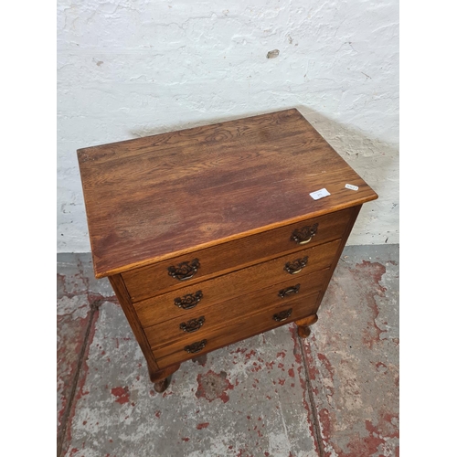 271 - A mid 20th century miniature oak chest of four drawers with cabriole supports - approx. 67cm high x ... 