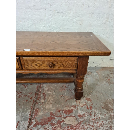 272 - A late 20th century solid oak two drawer rectangular coffee table with lower stretcher - approx. 50c... 