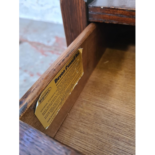 273 - A Bevan Funnell Reprodux oak four section Canterbury magazine rack with single drawer - approx. 54cm... 