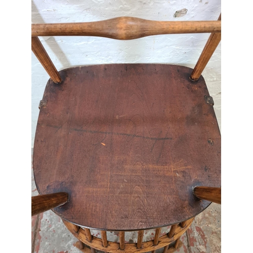 280 - A mid 20th century elm and beech spindle back armchair - approx. 98cm high x 52cm wide x 47cm deep