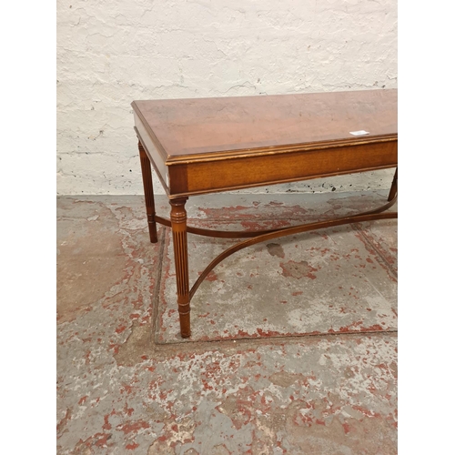 283 - A 19th century style mahogany rectangular coffee table with lower stretcher - approx. 46cm high x 49... 