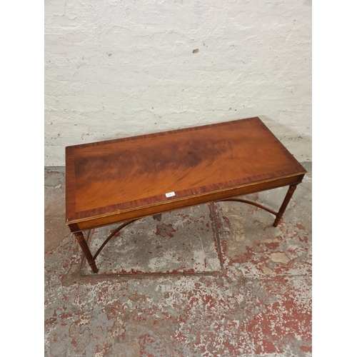 283 - A 19th century style mahogany rectangular coffee table with lower stretcher - approx. 46cm high x 49... 