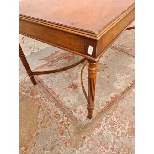 283 - A 19th century style mahogany rectangular coffee table with lower stretcher - approx. 46cm high x 49... 