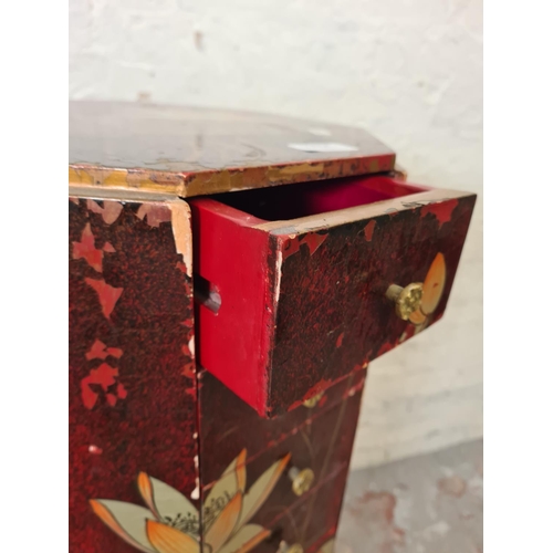 288A - An Oriental red lacquered and hand painted octagonal chest of eight drawers - approx. 103cm high x 3... 