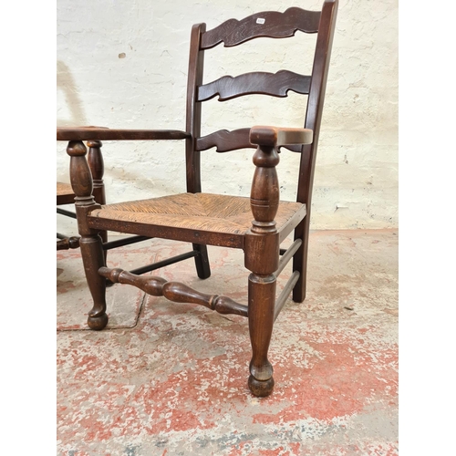 297 - A pair of 19th century style oak and rush seated low ladder back chairs - approx. 82cm high x 55cm w... 