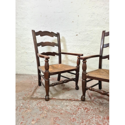 297 - A pair of 19th century style oak and rush seated low ladder back chairs - approx. 82cm high x 55cm w... 