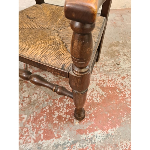 297 - A pair of 19th century style oak and rush seated low ladder back chairs - approx. 82cm high x 55cm w... 