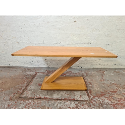 300A - A modern solid oak rectangular Z pedestal coffee table - approx. 45cm high x 45cm wide x 100cm long