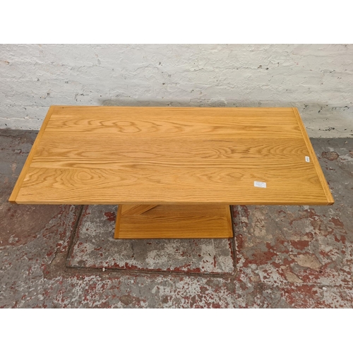 300A - A modern solid oak rectangular Z pedestal coffee table - approx. 45cm high x 45cm wide x 100cm long