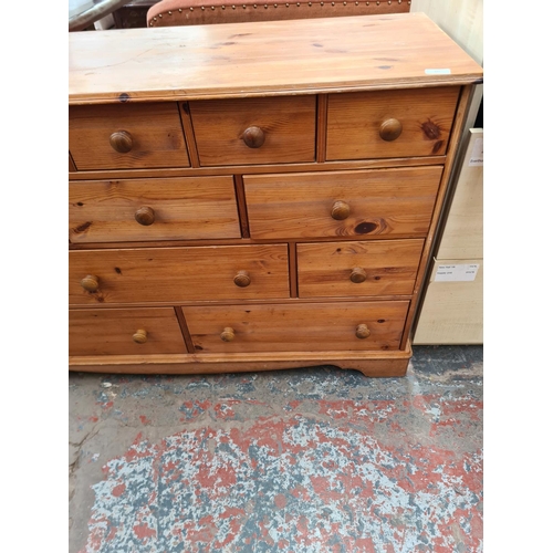 315 - A modern pine chest of thirteen drawers - approx. 84cm high x 125cm wide x 45cm deep