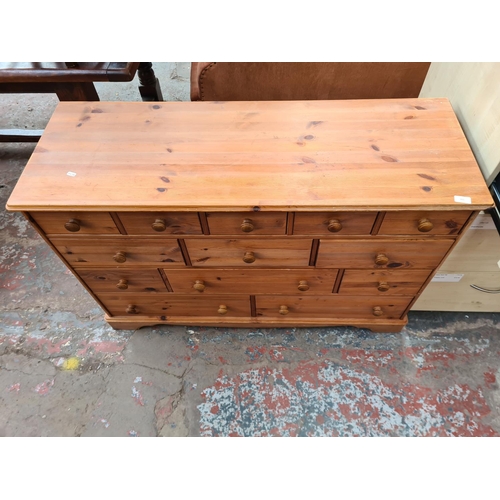 315 - A modern pine chest of thirteen drawers - approx. 84cm high x 125cm wide x 45cm deep