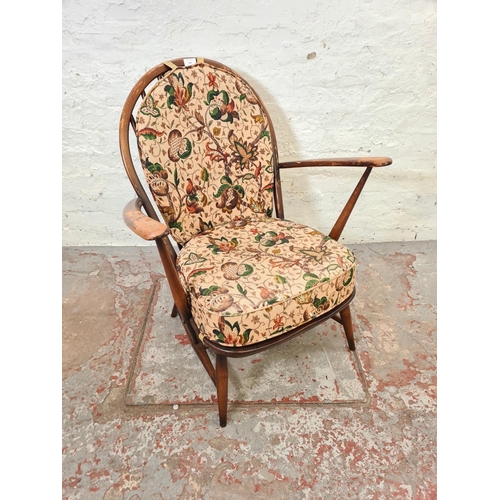 316 - An Ercol Fleur De Lys elm and beech armchair - approx.  82cm high x 69cm wide x 52cm deep