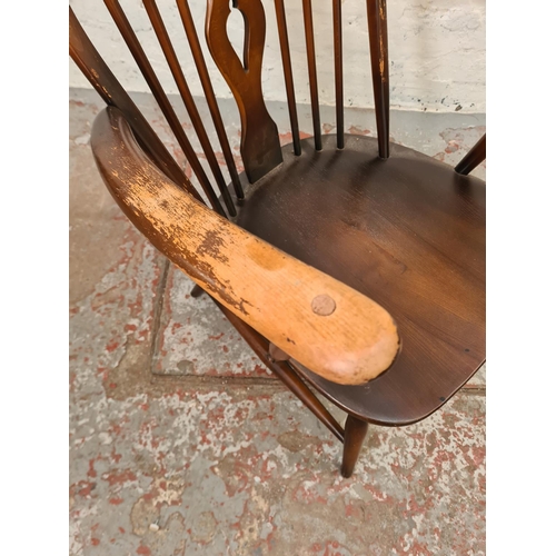 316 - An Ercol Fleur De Lys elm and beech armchair - approx.  82cm high x 69cm wide x 52cm deep