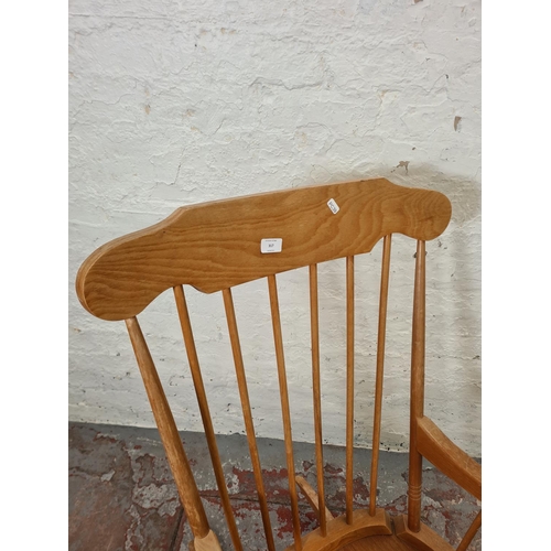 317 - A modern beech spindle back farmhouse rocking chair - approx. 96cm high x 55cm wide x 43cm deep