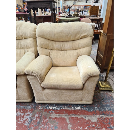 322 - A G Plan beige upholstered three piece lounge suite comprising two seater sofa, electric reclining a... 