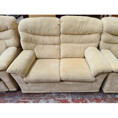 322 - A G Plan beige upholstered three piece lounge suite comprising two seater sofa, electric reclining a... 