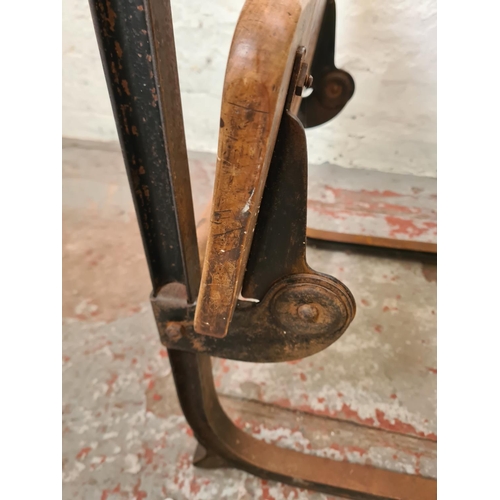 324 - An early 20th century elm and cast iron child's school desk and chair - approx. 74cm high x 62cm wid... 