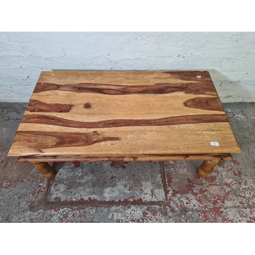 348 - An Indian sheesham wood rectangular coffee table - approx. 40cm high x 61cm wide x 110cm long