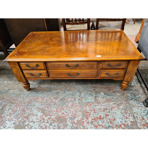 349 - A Klaussner cherry wood rectangular coffee table with five drawers - approx. 48cm high x 71cm wide x... 